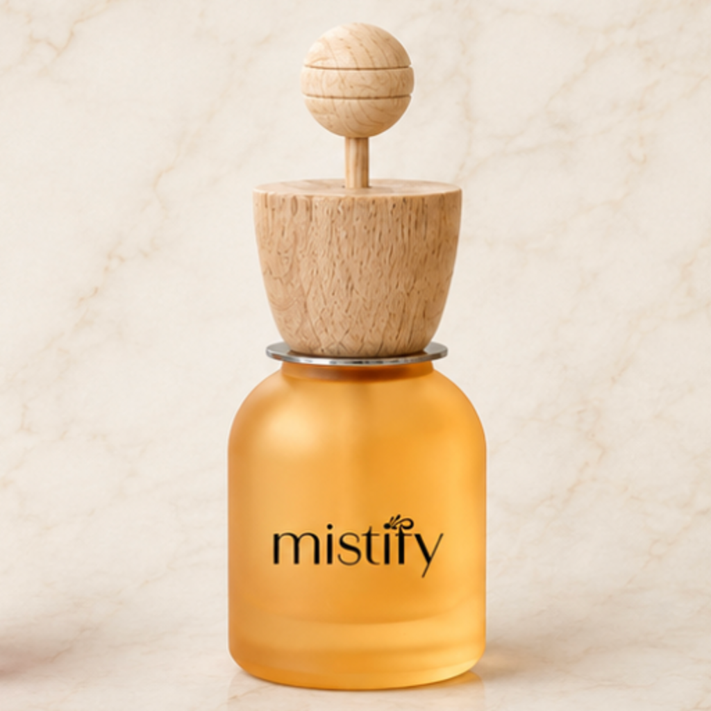 Mistify Parfums car diffuser with orange scent, showcasing the sleek diffuser device designed to enhance your vehicle's aroma.