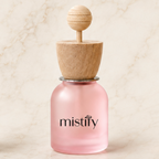 Pink Mistify Parfums car diffuser with adjustable scent vents and decorative pink design for freshening vehicle interiors.