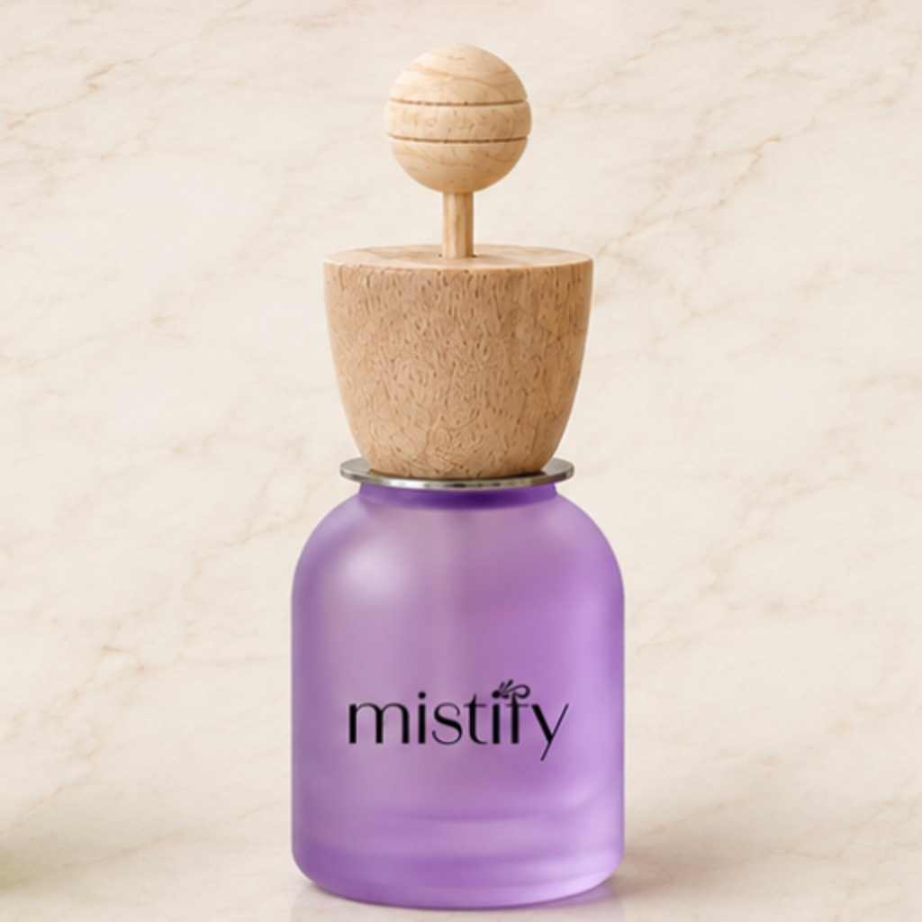 Purple Mistify Parfums car diffuser with customizable scent, designed to freshen vehicle interiors with a sleek, compact style.